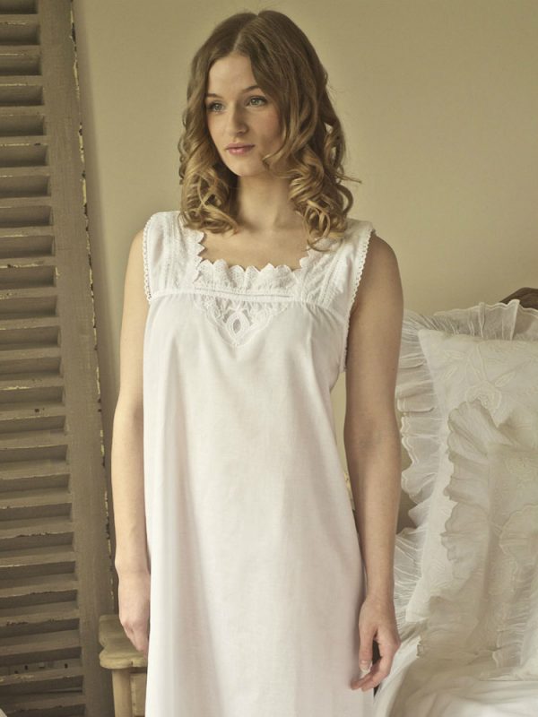 Victorian nightgown. Treat yourself to our gorgeous ladies' Victorian style nightgown. This lovely nightdress is made from the fine soft 100% cotton. This sleeveless design is timeless and flatters all shapes and sizes. It features delicate broderie anglaise detail around the square neck and arm holes making it perfect for warm summer nights and would be great to take away on holiday. This full nightie is ideal to wear during pregnancy and breastfeeding with 2 detachable mother of pearl buttons on each shoulder. Originates from the Victorian chemises. We know our customers love our Victorian nightgowns.