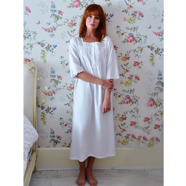 Three Quarter sleeve nightdress. Beautiful Nightdress embroidery cut work detail around the square neckline and hem of 3/4 length sleeves and pretty shell buttons at the chest. A captivating nightdress which is also ideal for maternity and will aid that peaceful nights sleep. 100% thicker cotton.