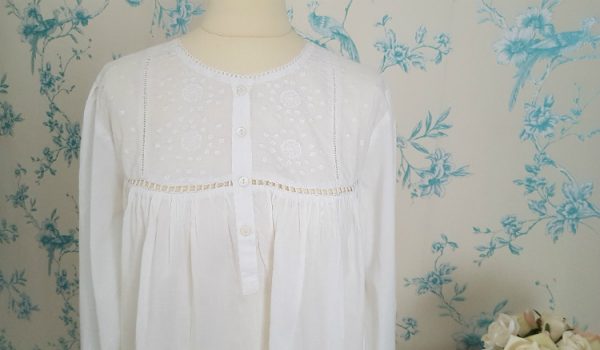 Our  long white cotton nighties - Amelia is a graceful round necked, excellent quality fine soft  100% cotton nightgown. This pleasing nightdress has four opening shell buttons down the front, and long sleeves which are finished off with a single shell button on each cuff. The embroidery on this lovely nightie is stunning and it would make an ideal 'special' gift. Our  long white cotton nighties are also ideal to wear during pregnancy and breastfeeding.