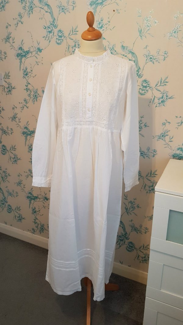 Long Nighties for Ladies. Paula is a gorgeously soft cotton round neck necked nightgown with subtle white embroidery on the bodice and pin tucked pleats running across the skirt. This nightie has opening shell buttons on the front and cuffs, this comfortable and charming nightgown is a sure favourite with everyone.  This nightie is ideal to wear during pregnancy and breastfeeding.