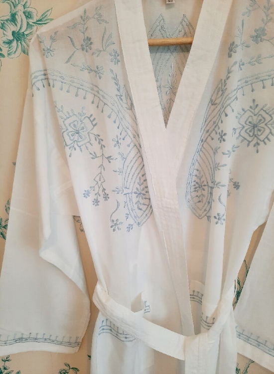 ladies lightweight dressing gown, 17th Century inspired gorgeous Renaissance 100% cotton dressing gown, has exquisite intricate silver blue detailed embroidery with three-quarter length sleeves. A tie belt and 2 pockets which matches our Renaissance Nightdress making it a perfect combination to take away on holiday or as a perfect gift for someone you love