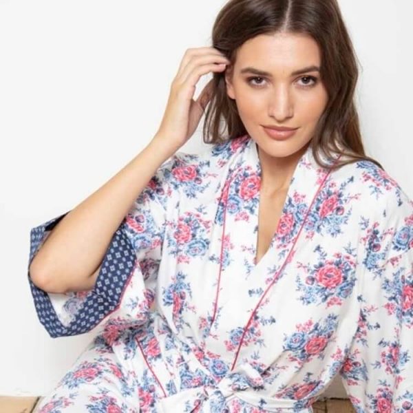 Rose Patch Kimono dressing gown is so retro and is  made from 100%  soft breathable cotton.  Adorable Rose flowers  with contrasting blue and white diamond patch design around the deep cuffs of the 3/4 length sleeves.  Red satin trim is also placed around the collar and two front  pockets with a full length tie belt. It is so chic and a delight to wear.